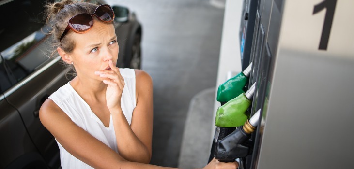 A woman being stressed about gas prices